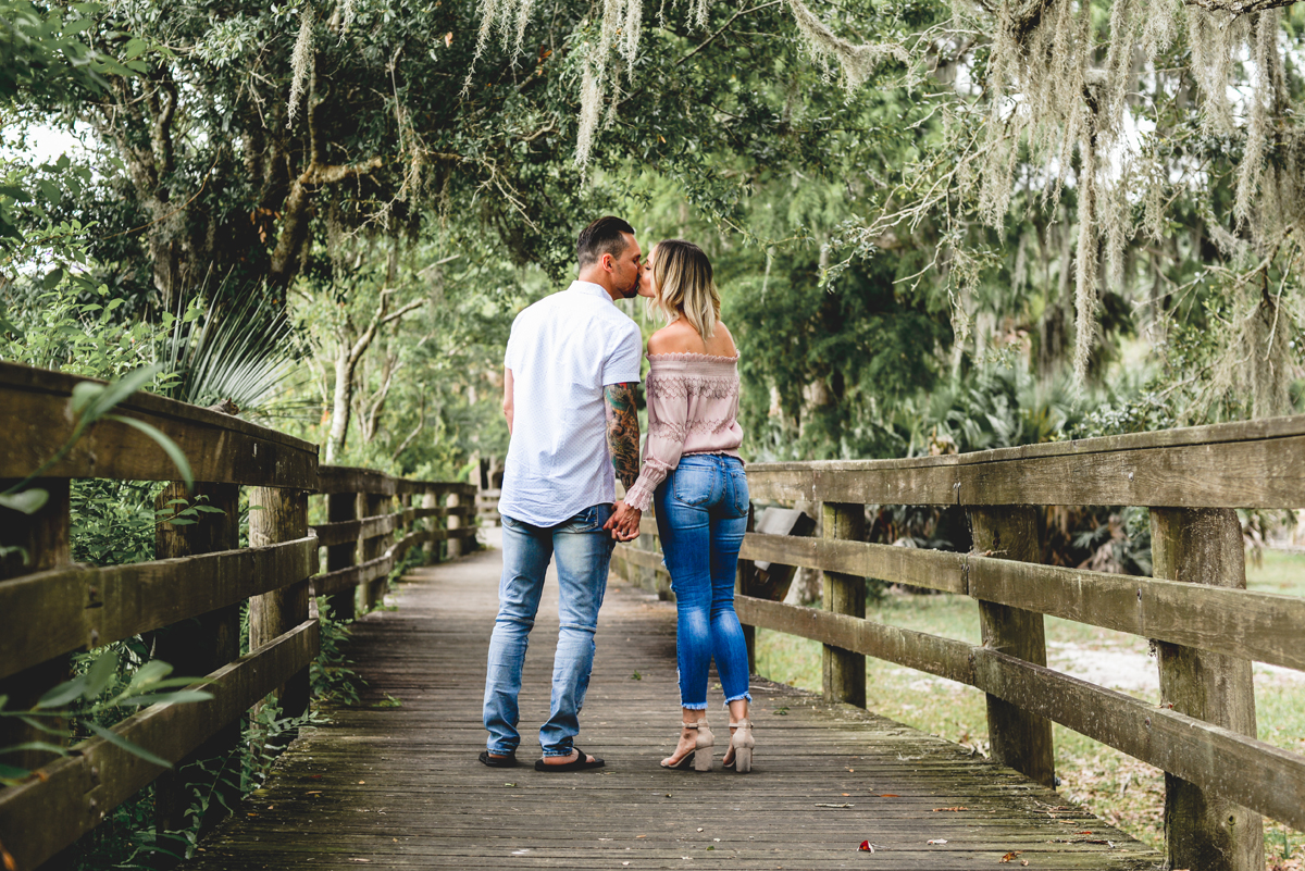 boardwalk, trees, nature, moss, kissing, holding hands