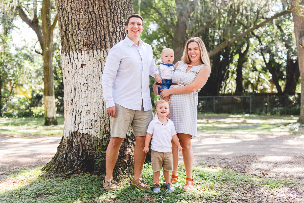 family, mom, dad, brothers, tree, park, grass