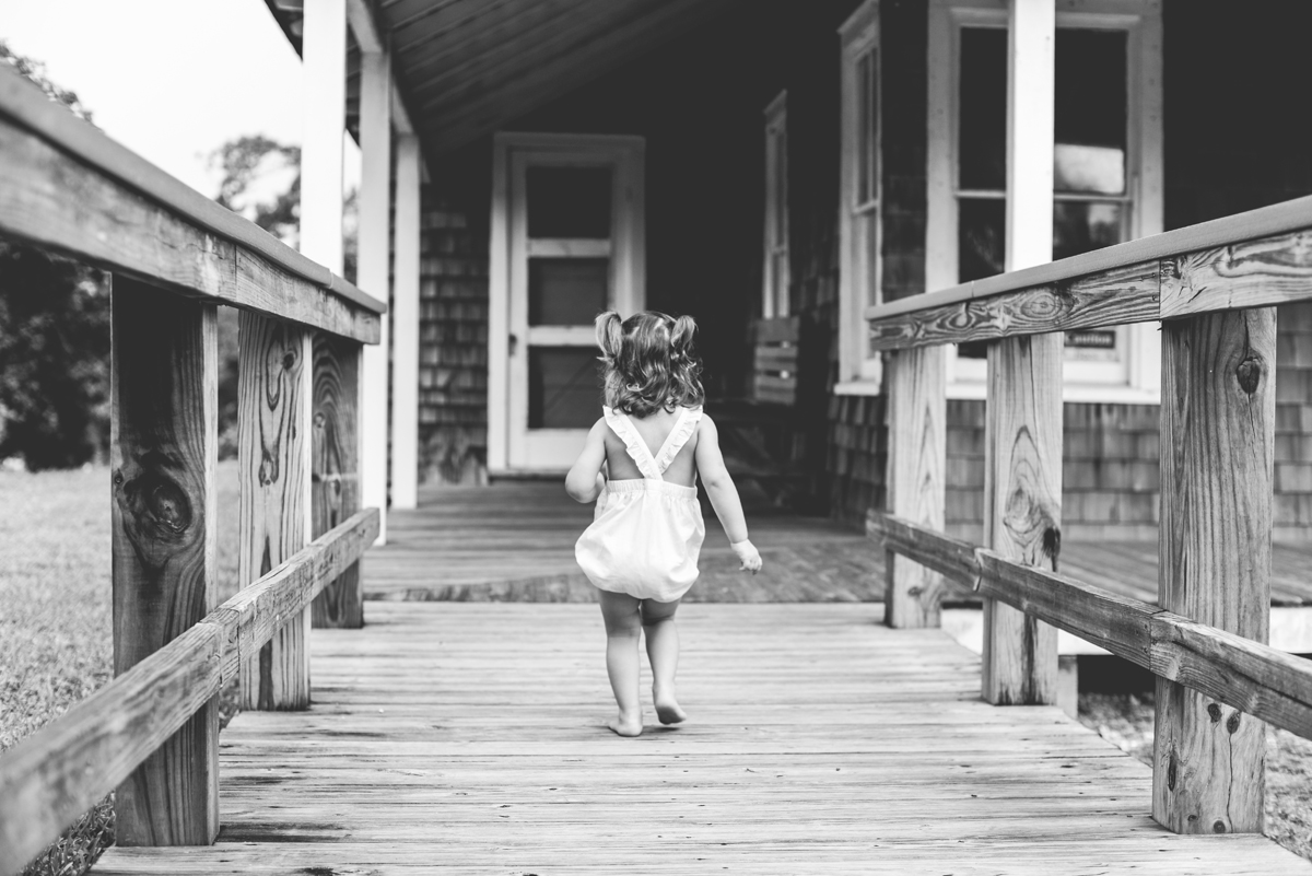 toddler, black and white, boardwalk, house