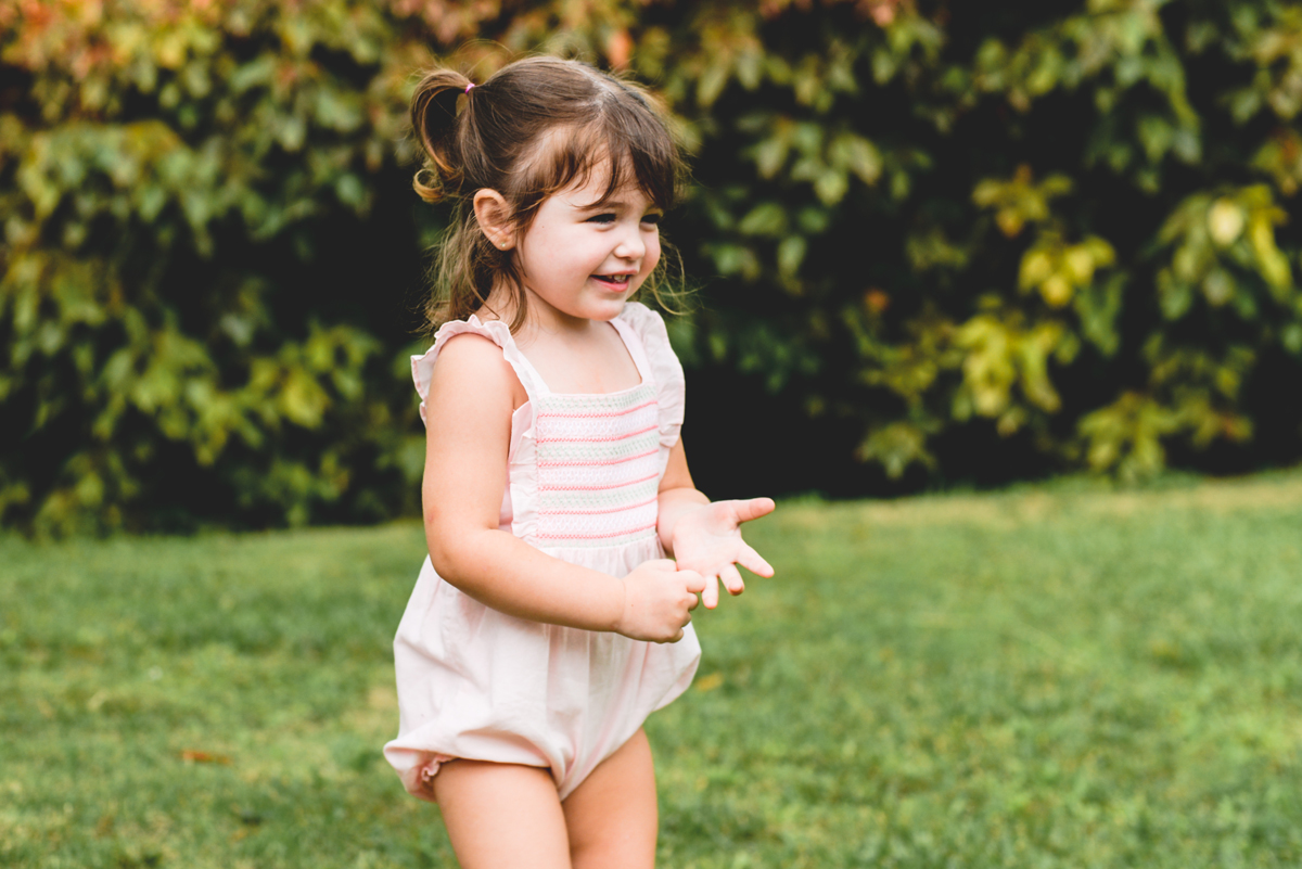 toddler, running, laughing, smiling, pigtails 