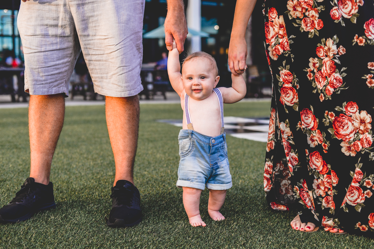 mom, dad, baby, holding hands, grass