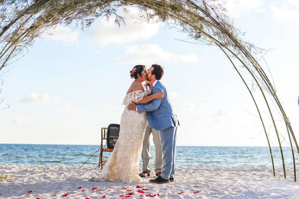 first kiss, just married, ocean, beach, wedding