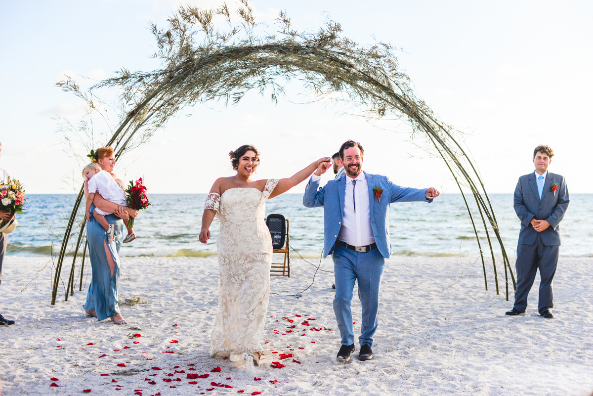 celebrating, just married, isle, beach wedding, 