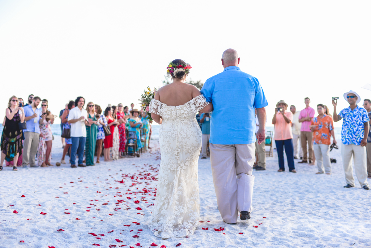 bride, walking, isle, flower petals, groom 