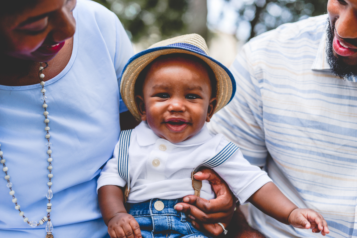 family, baby, blue, hat, suspenders, smiling