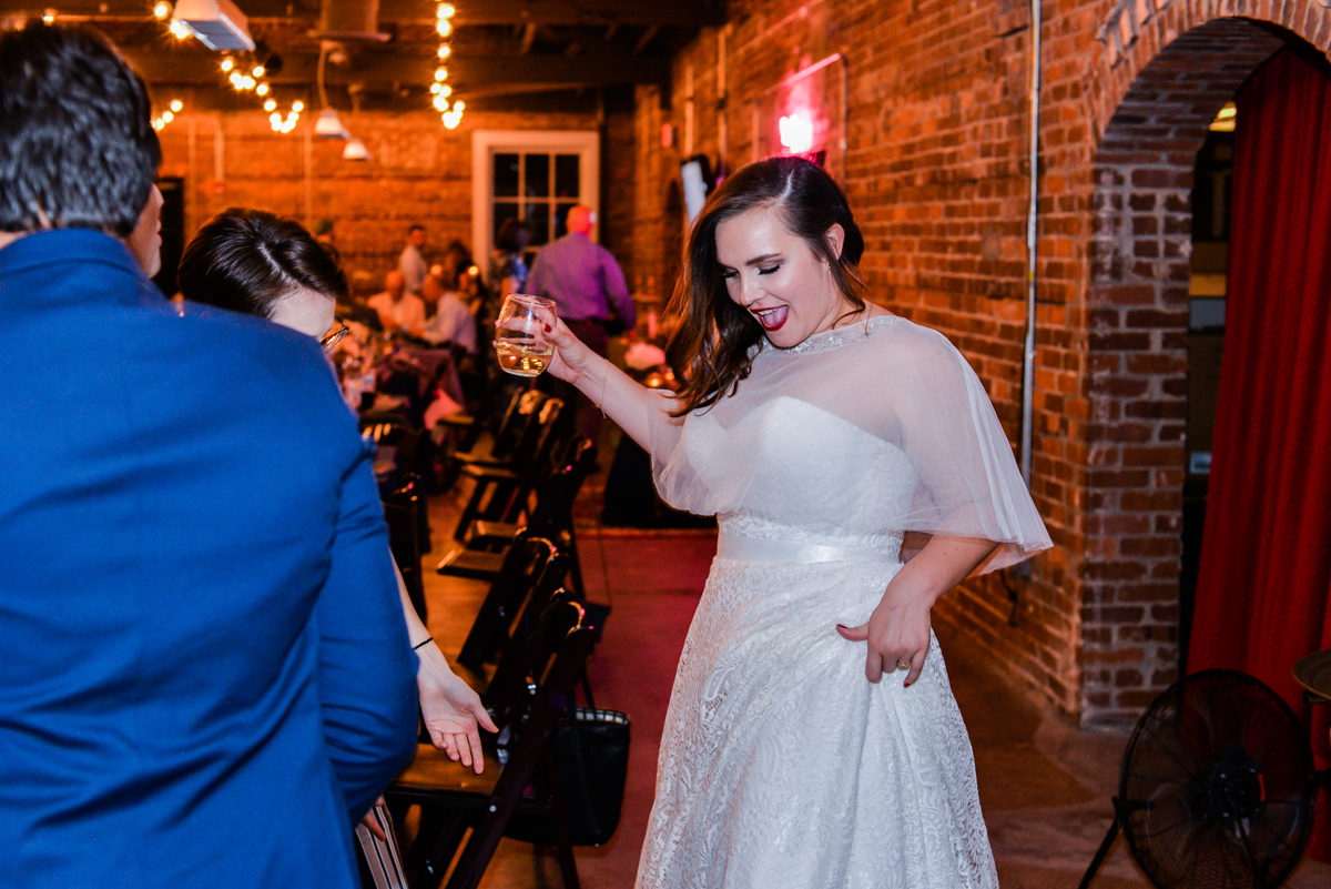 bride, dancing, party, bricks, lighting, wedding dress