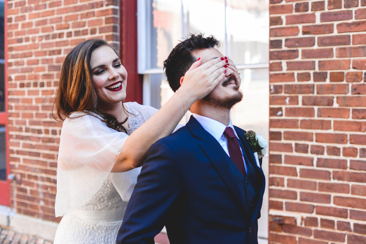 first look, covering eyes, brick, bride, groom