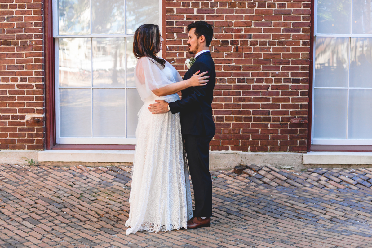 first look, posed, bride, groom, brick, wedding day