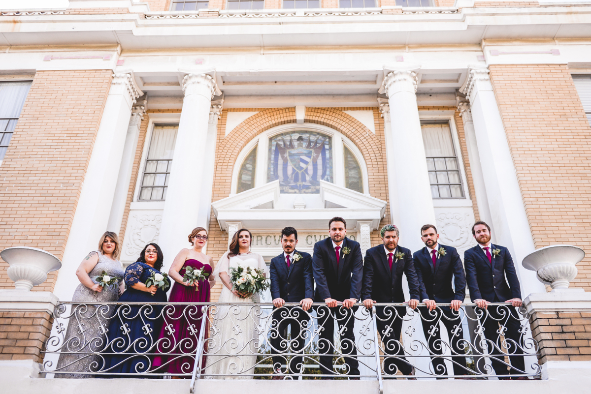 bridal party, courthouse, ybor, serious face, fence