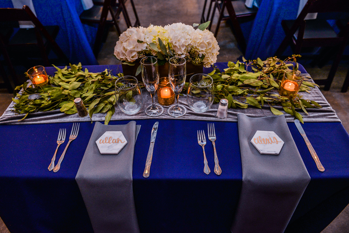 head table, husband, wife, groom, chairs, candles, lighting, flowers