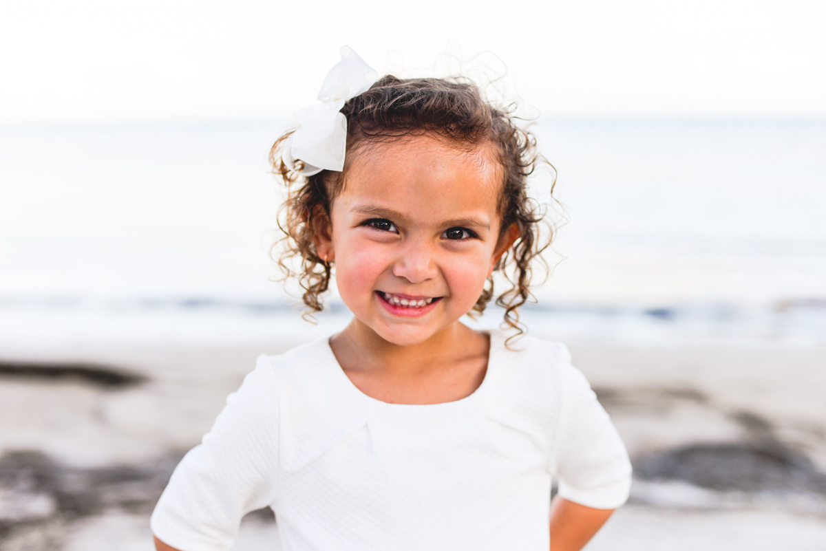 girl, curly hair, bow, sand, beach, water