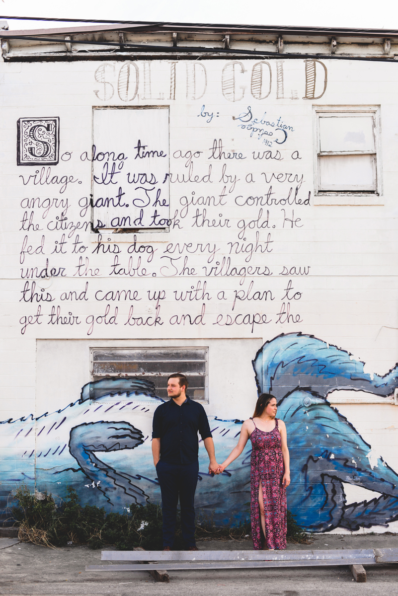 story, couple, holding hands, wall art, dog