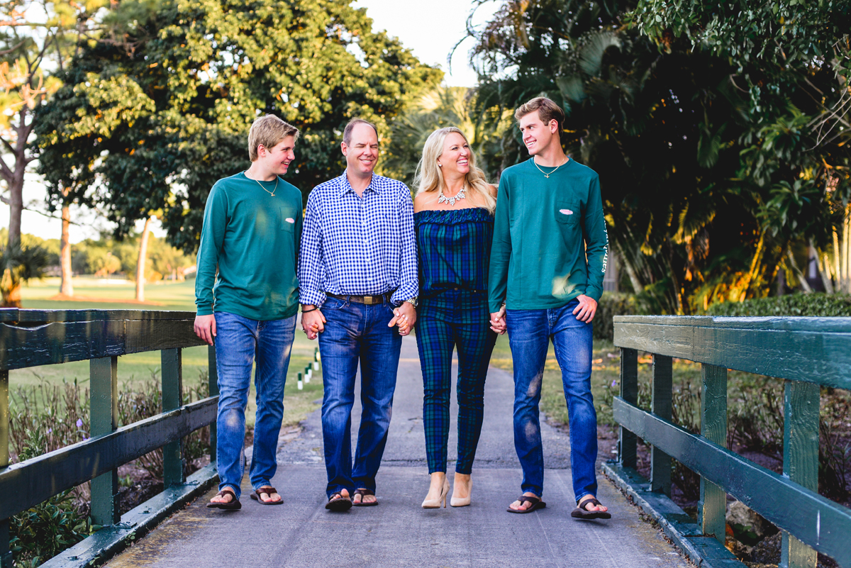 family, greenery, gold course, holding hands, walking