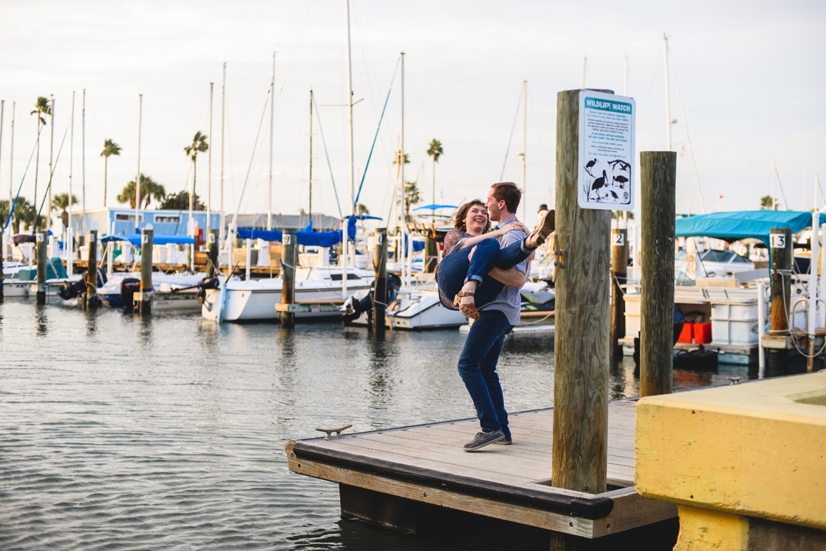 boat, dock, water, sunset, couple, engagement, laughing