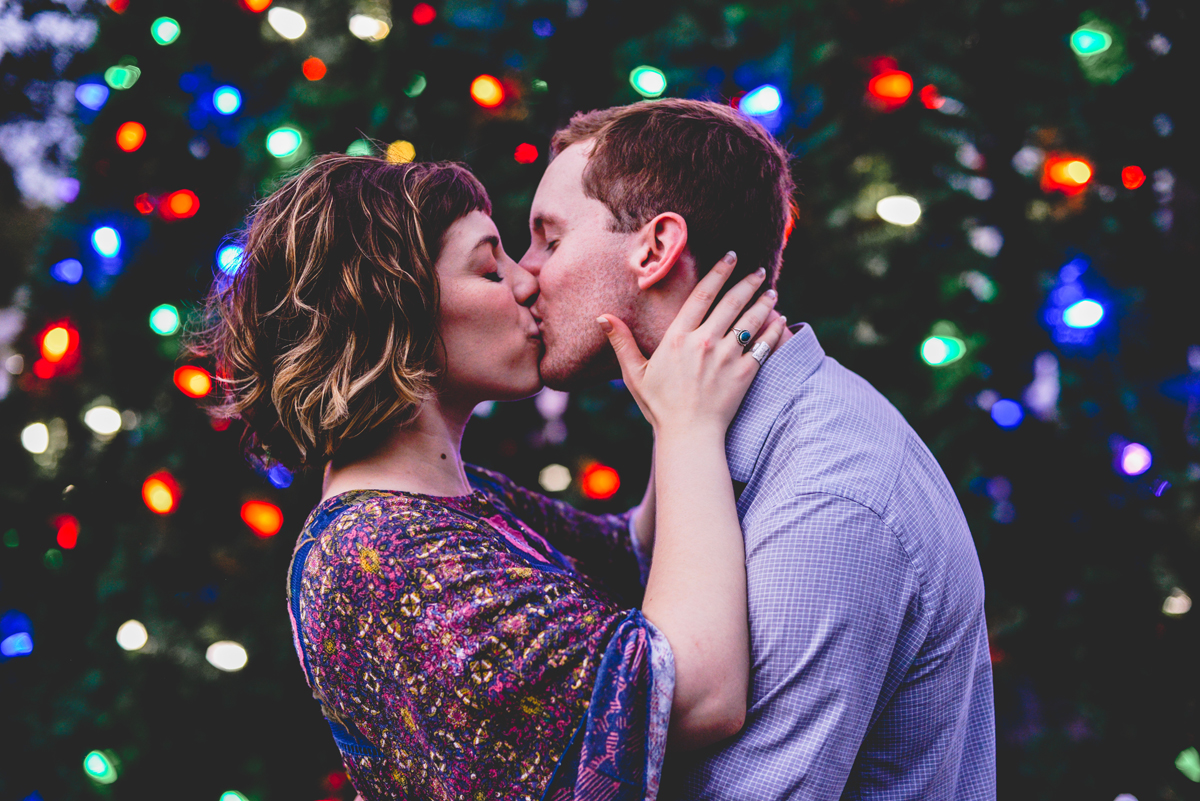 christmas tree, christmas lights, couple, engaged, kissing