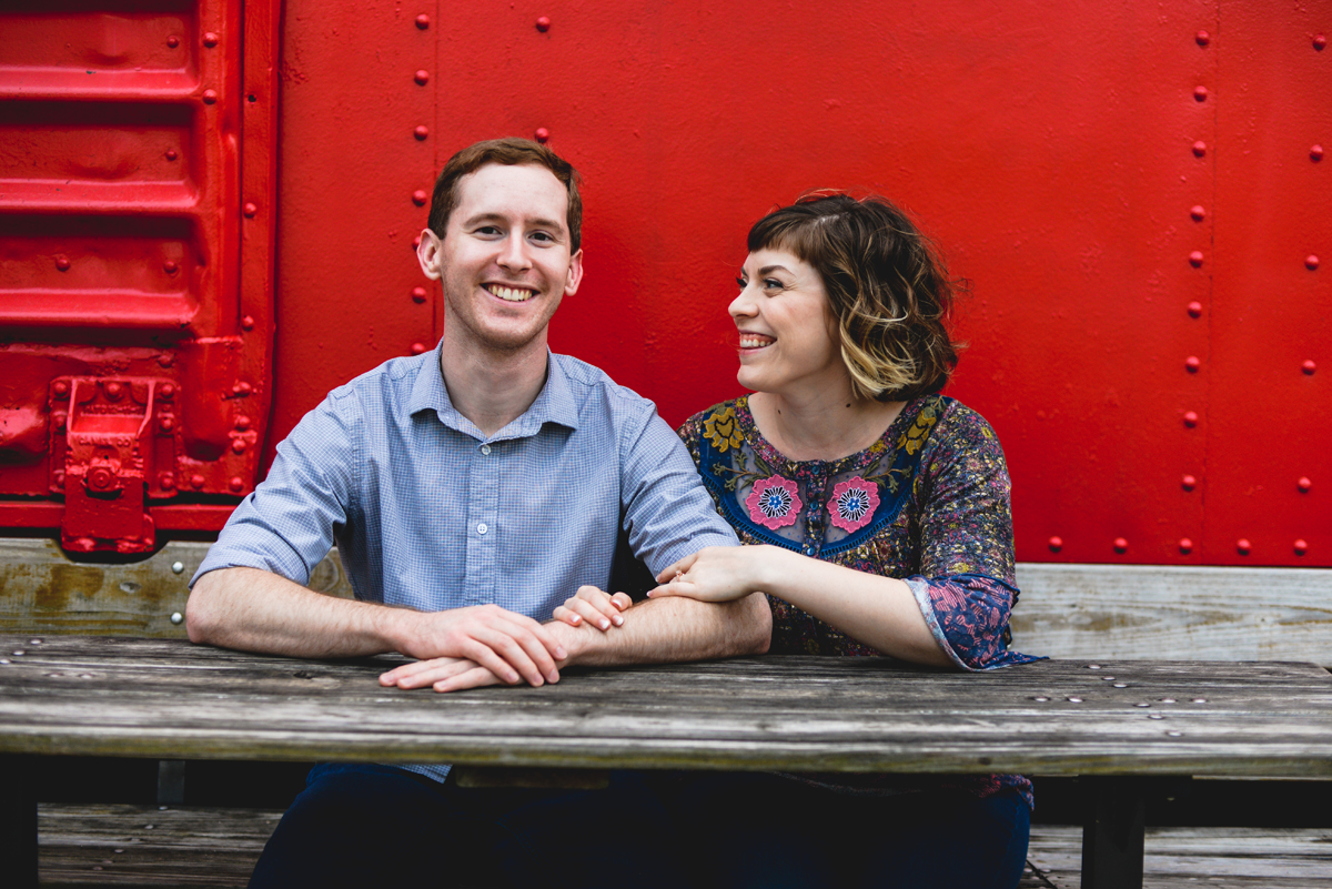 red, table, box car, smiling, portrait 