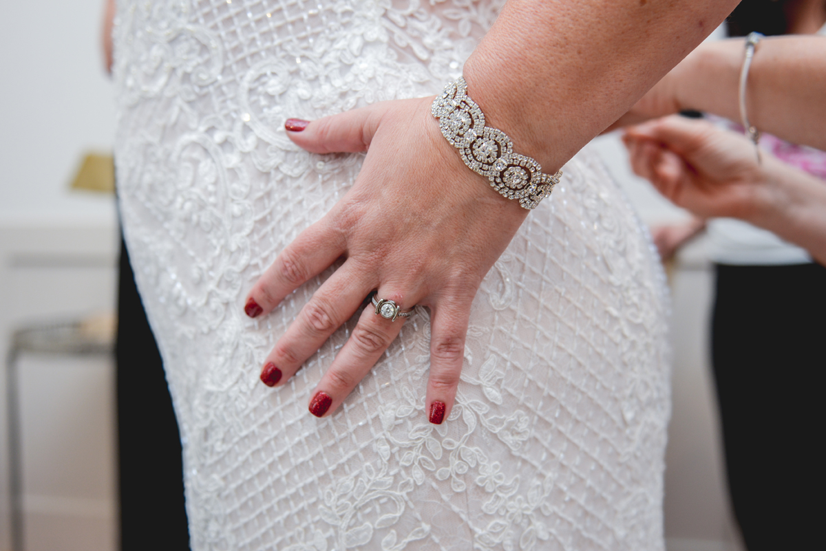 bride, red nails, diamond ring, bracelet, lace