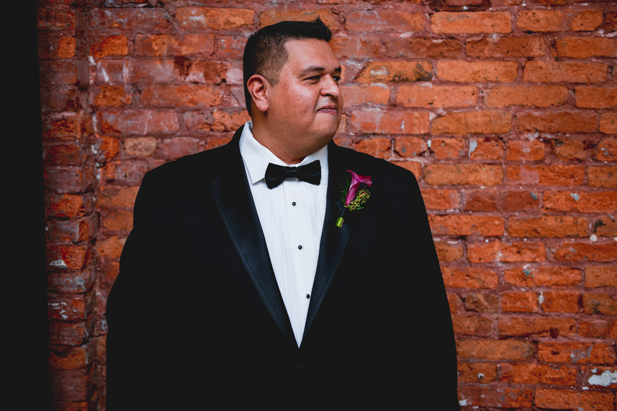 groom, brick, tux, black tie, wedding day