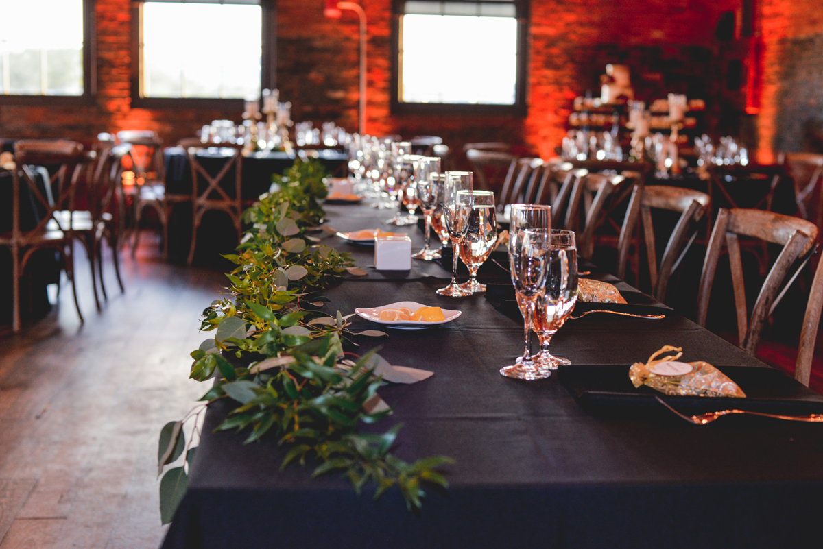 table, greenery, venue, brick, red, garland 