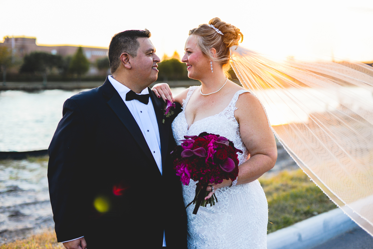 bride, groom, sunset, veil, just married, black tie