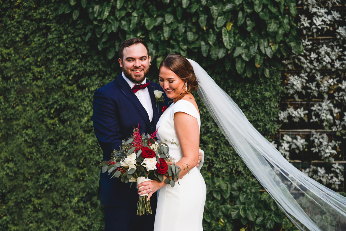 candid, just married, bride, groom, veil, laughing