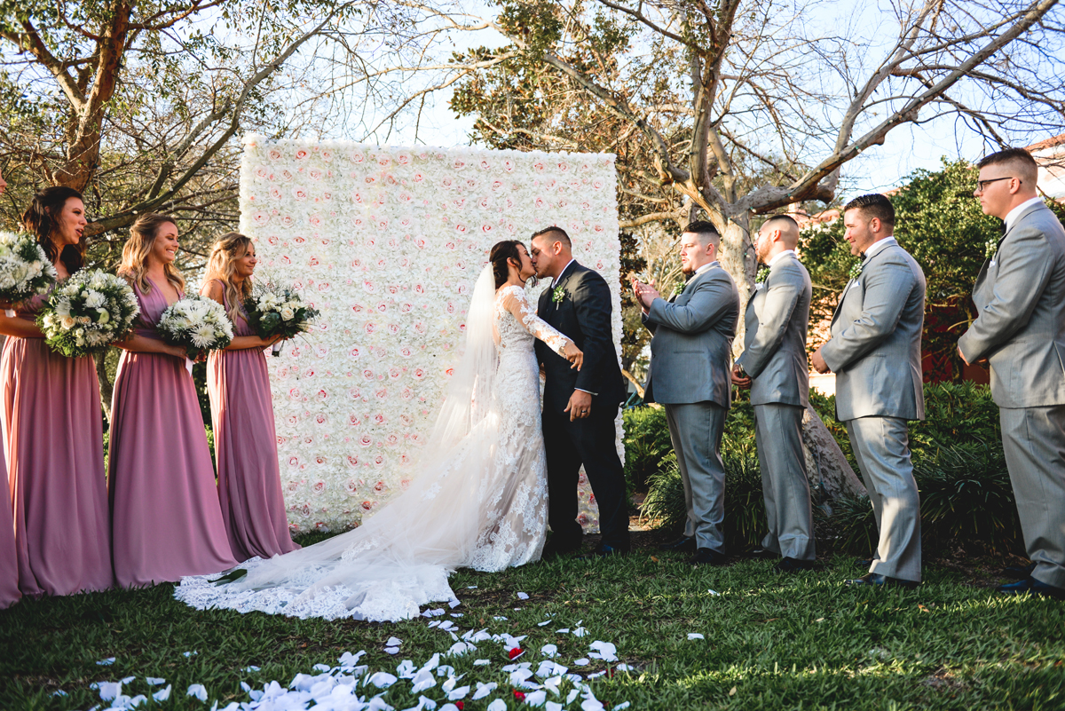 wedding, first kiss, grass, flowers, friends, family