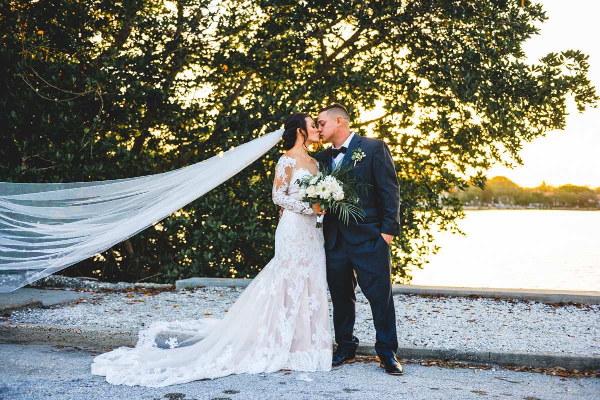 wedding day, sunset, kissing, bride, groom, just married