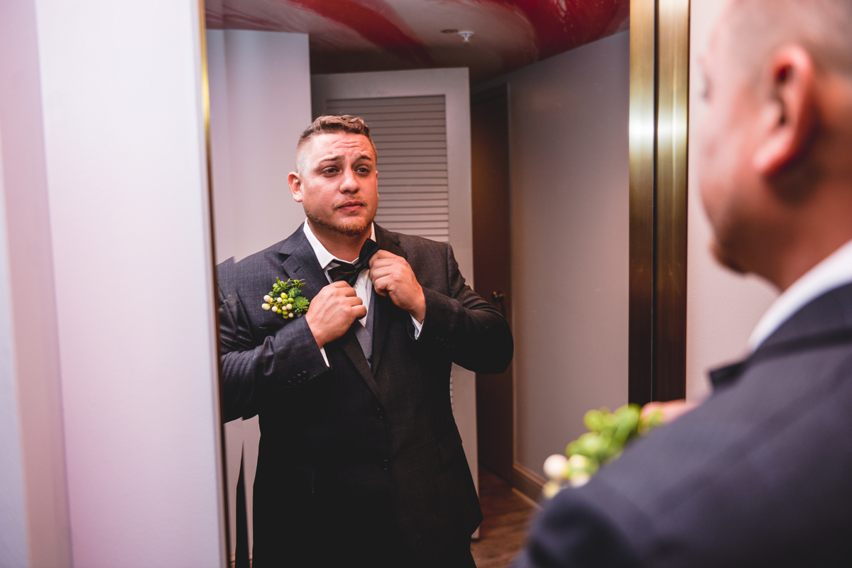 groom, bowtie, getting ready, mirror, wedding