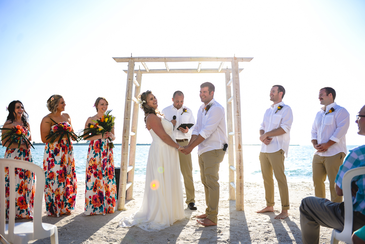 beach, wedding, ceremony, arch, couple, laughing