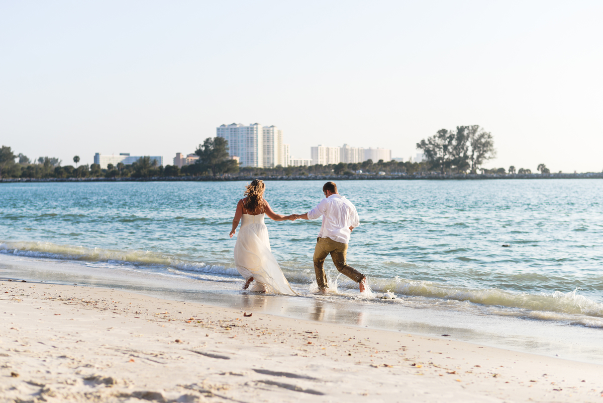 beach, bride, groom, running, ocean, sand