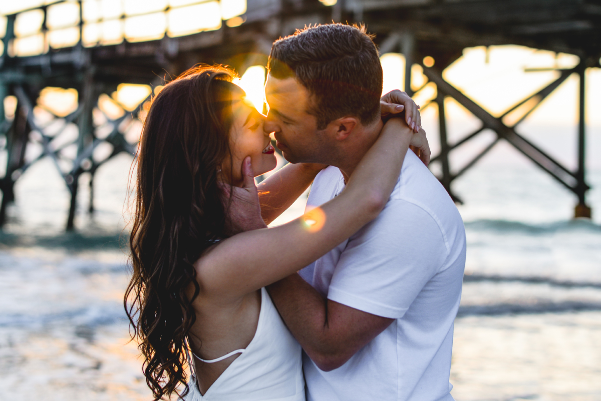 couple, sunflare, ocean, sunset, beach, pier