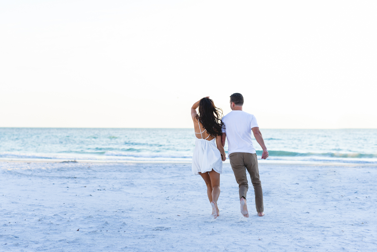 beach, sand, ocean, couple, running, holding hands