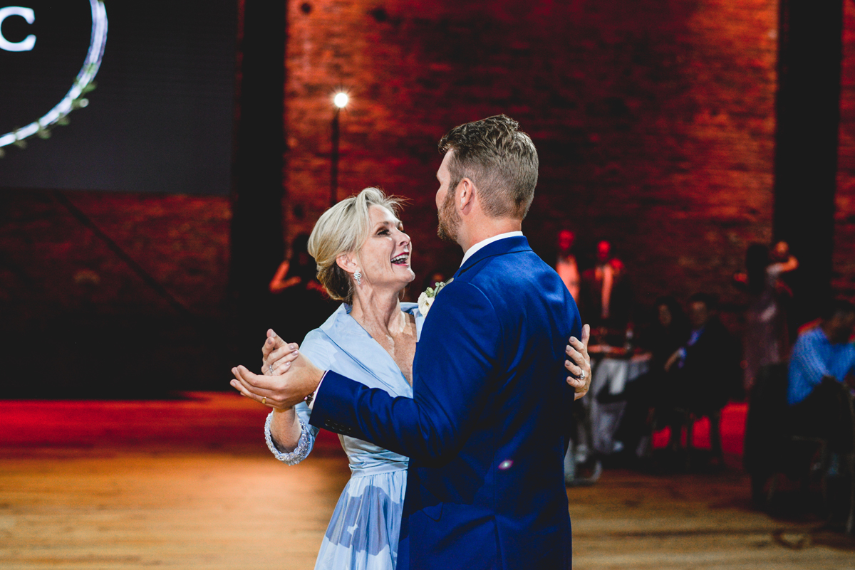 mom, son, wedding, first dance, brick, wood, lights