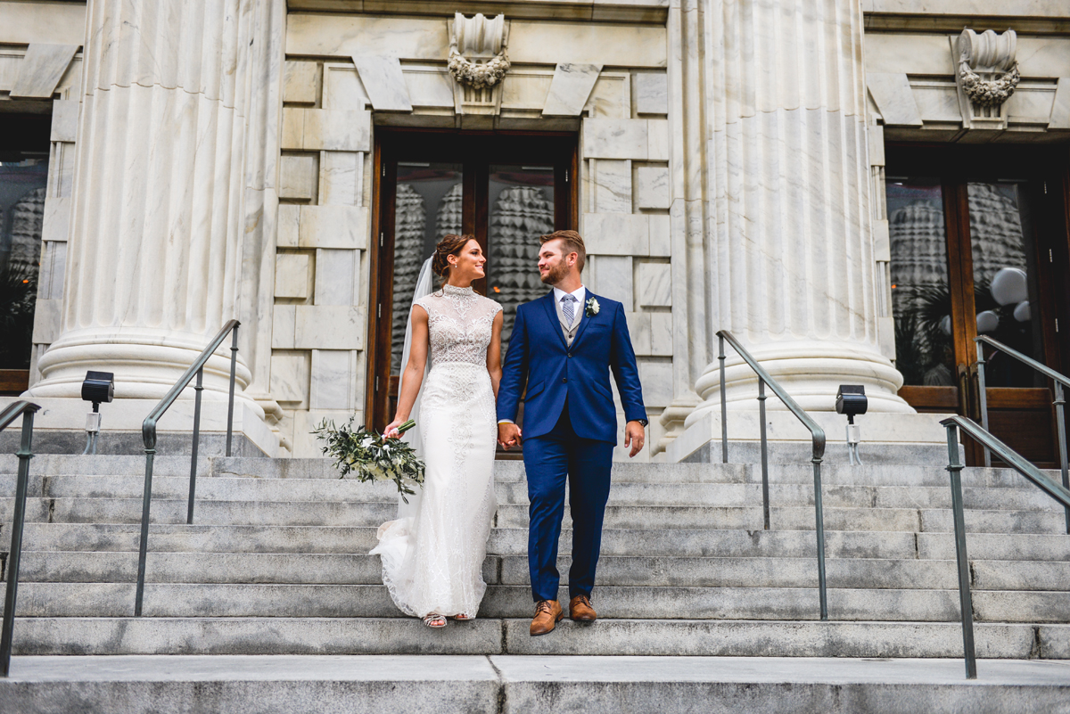 bride, groom, steps, walking, holding hands