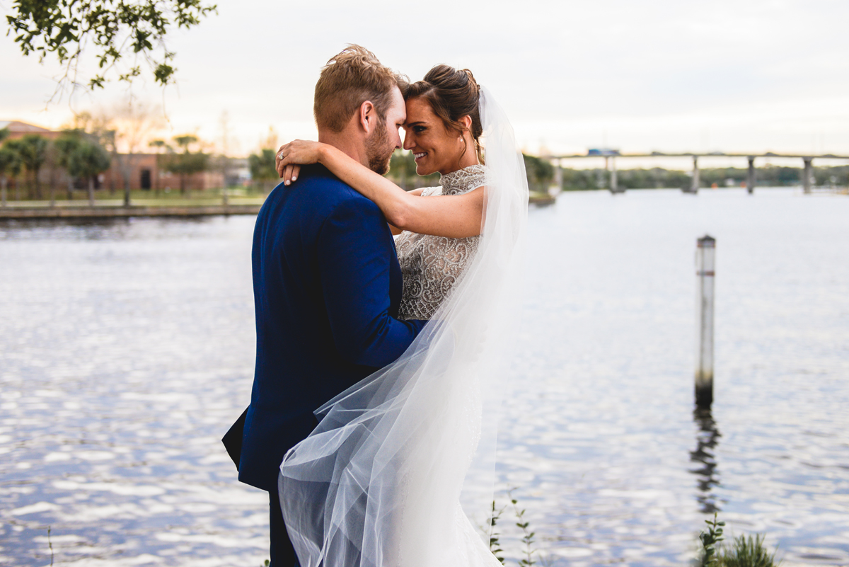 bride, groom, water, hugging, bridge, windy