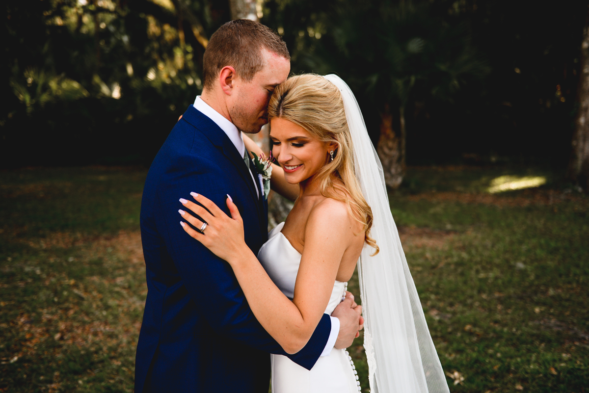 bride, groom, hugging, wedding, just married, greenery