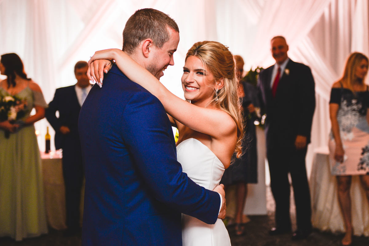 first dance, husband, wife, hugging, smiling 