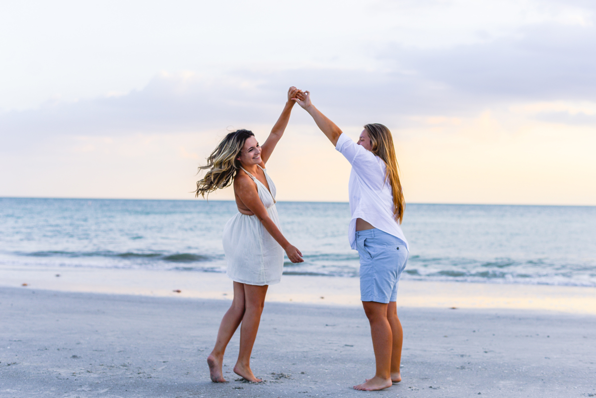 dancing, sunset, ocean, sand, waves