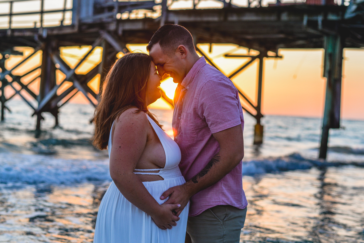 pier, sunset, ocean, waves, water, couple, maternity