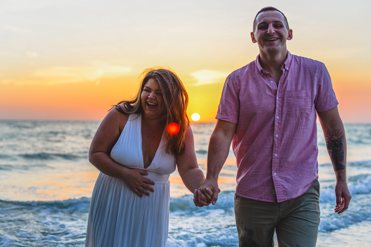 laughing, couple, holding hands, waves, oceans, sunset