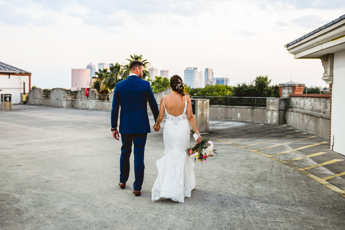 holding hands, walking, downtown, skyline