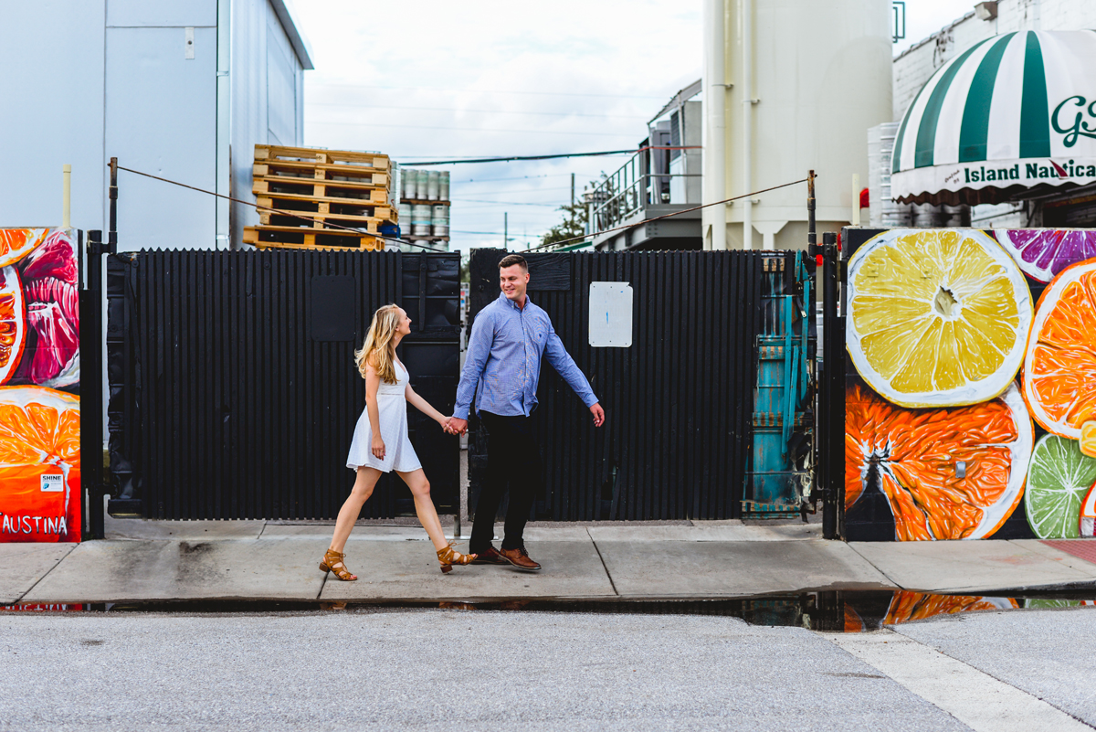 holding hands, walking, mural, fruit 