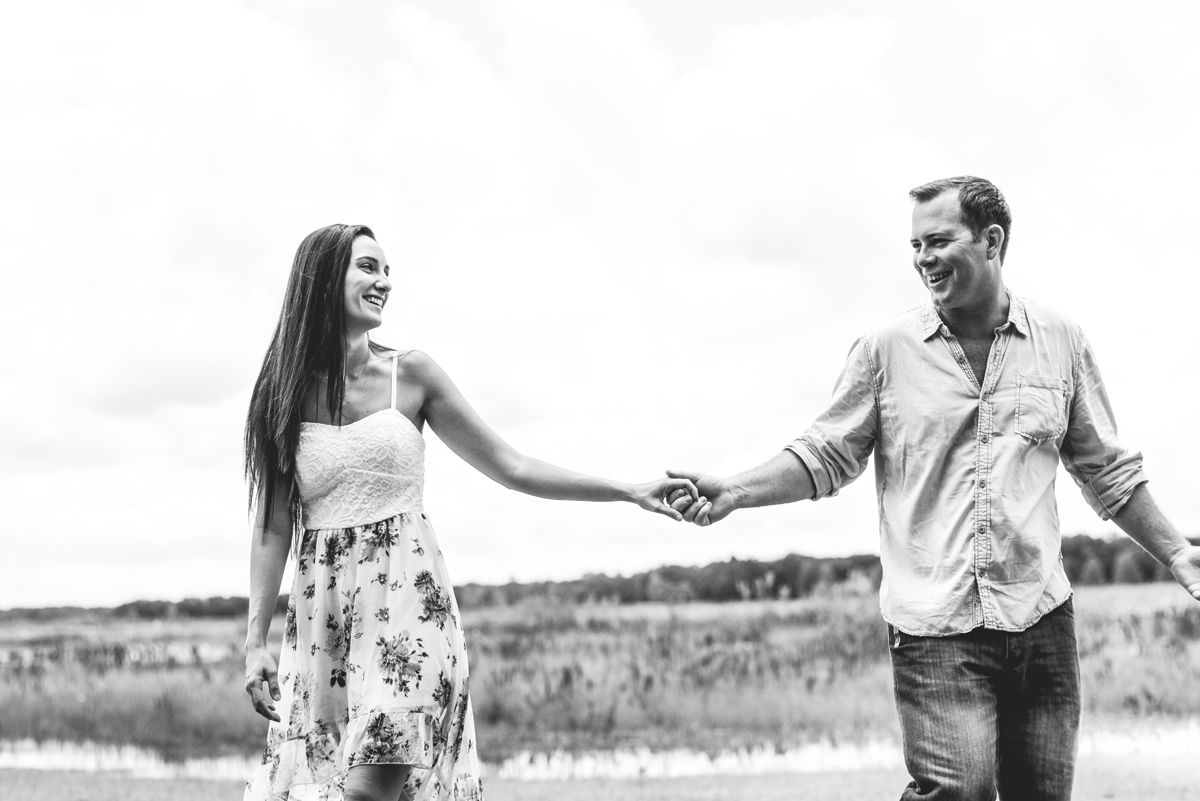 black and white, holding hands, couple, laughing